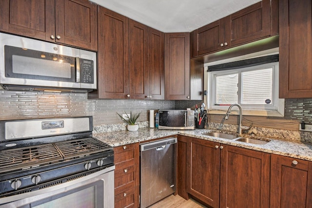 17852 Walter St, Lansing, IL 60438 - kitchen featuring stainless steel appliances, light stone countertops, backsplash, and light wood-type flooring