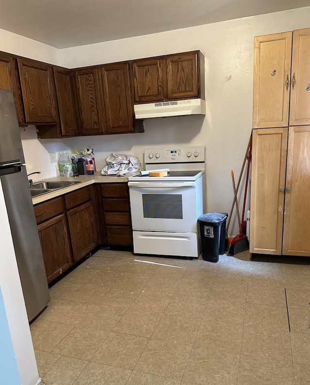 833 N Randall Rd Unit C3, Aurora, IL 60506 - kitchen featuring white electric stove, under cabinet range hood, freestanding refrigerator, light countertops, and dark brown cabinetry