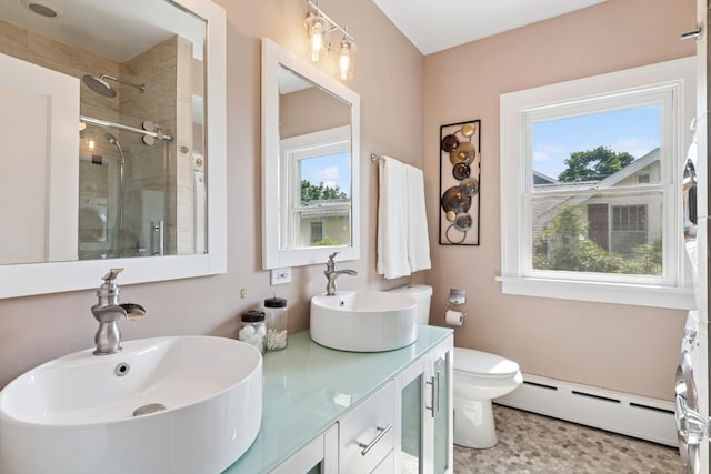 720 Ingleside Pl, Evanston, IL 60201 - bathroom featuring baseboard heating, a shower stall, and double vanity