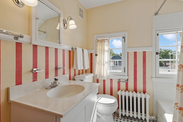 720 Ingleside Pl, Evanston, IL 60201 - full bath with radiator heating unit, vanity, and wallpapered walls