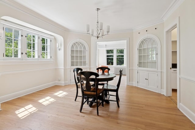 720 Ingleside Pl, Evanston, IL 60201 - dining area featuring healthy amount of natural light, ornamental molding, a chandelier, and light wood finished floors