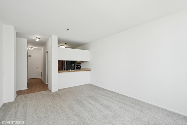 780 S Federal St Unit 1006, Chicago, IL 60605 - unfurnished living room featuring a sink and carpet