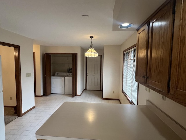 310 Massasoit St, Minooka, IL 60447 - unfurnished dining area with baseboards, washer and clothes dryer, light floors, and recessed lighting