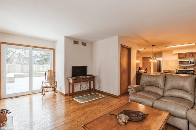 1908 Hazelwood Dr, Lindenhurst, IL 60046 - living area with light wood-type flooring and baseboards