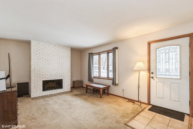 1908 Hazelwood Dr, Lindenhurst, IL 60046 - carpeted entrance foyer featuring a brick fireplace and baseboards