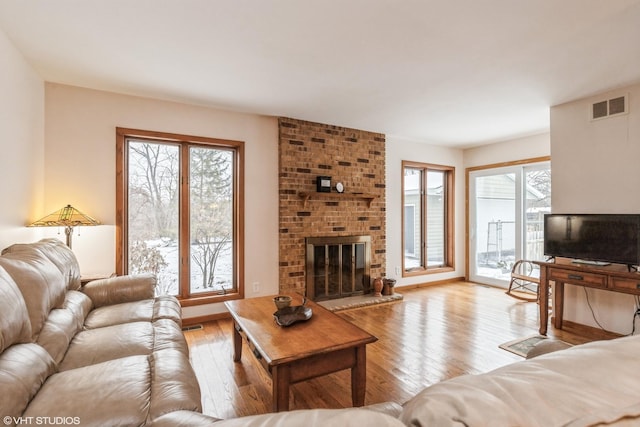 1908 Hazelwood Dr, Lindenhurst, IL 60046 - living room featuring light wood-type flooring and a fireplace