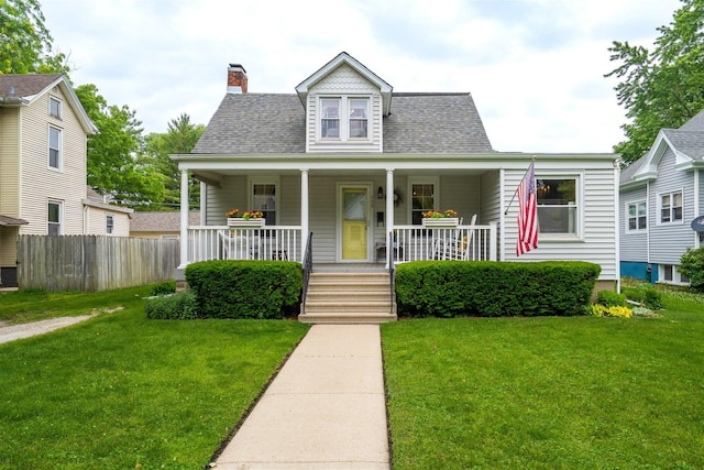 735 W Henry St, Pontiac, IL 61764 - view of front facade featuring a chimney, covered porch, and a shingled roof