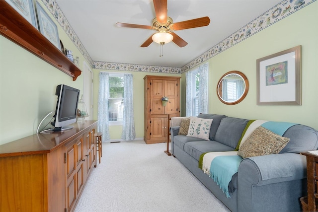 735 W Henry St, Pontiac, IL 61764 - living area with ceiling fan and light carpet
