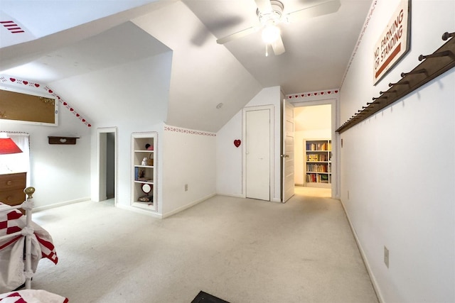 735 W Henry St, Pontiac, IL 61764 - additional living space featuring built in shelves, carpet floors, lofted ceiling, and a ceiling fan
