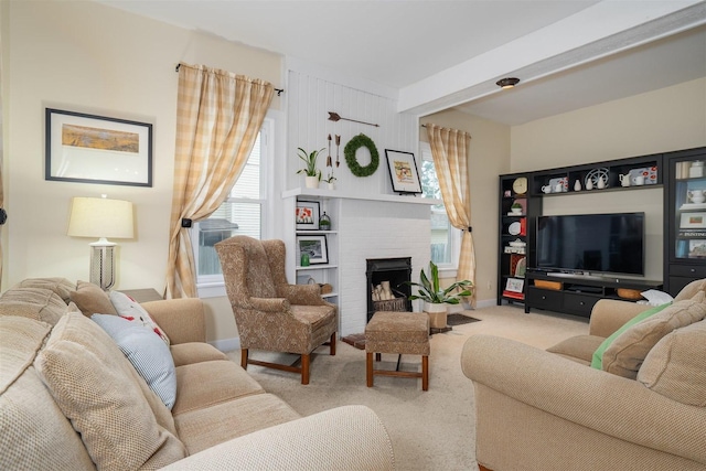 735 W Henry St, Pontiac, IL 61764 - living room featuring healthy amount of natural light, carpet floors, and a fireplace