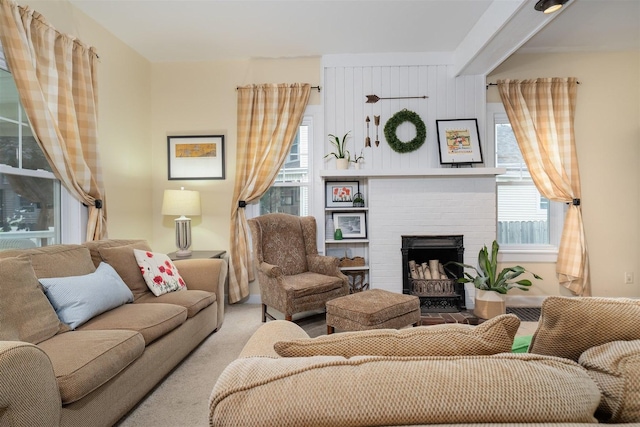 735 W Henry St, Pontiac, IL 61764 - carpeted living area featuring a brick fireplace and healthy amount of natural light