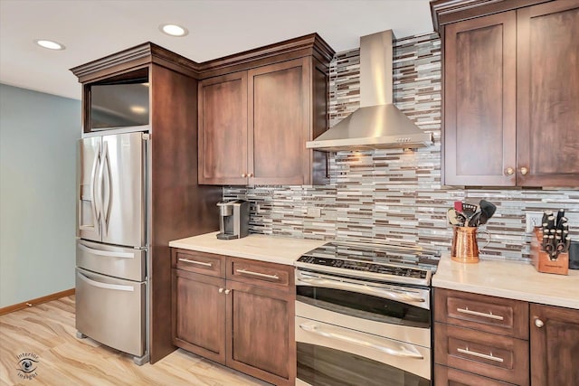 3242 W 108th Pl, Chicago, IL 60655 - kitchen with stainless steel appliances, wall chimney exhaust hood, light countertops, light wood-style floors, and recessed lighting