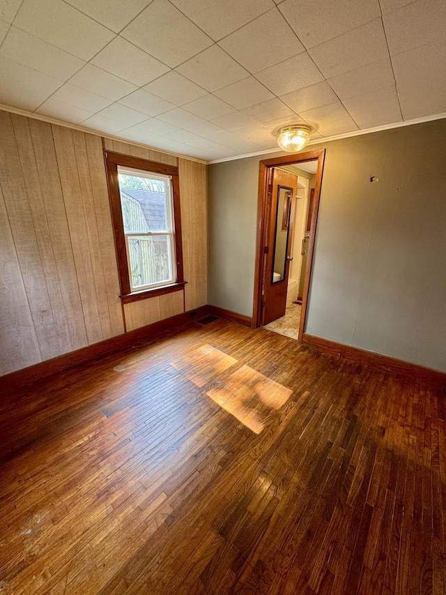 1202 E Water St, Pontiac, IL 61764 - unfurnished room featuring hardwood / wood-style floors, baseboards, and ornamental molding