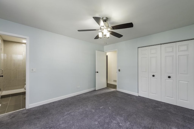 907 Lorelei Dr, Zion, IL 60099 - unfurnished bedroom featuring dark carpet, a closet, ceiling fan, and connected bathroom