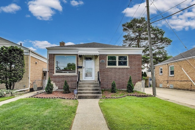 2219 Keystone Ave, North Riverside, IL 60546 - bungalow-style home with entry steps, brick siding, and a chimney