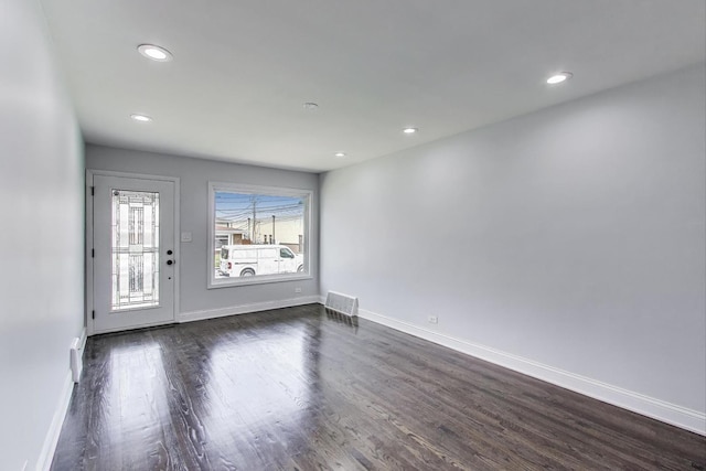 2219 Keystone Ave, North Riverside, IL 60546 - unfurnished room with dark wood-type flooring and recessed lighting
