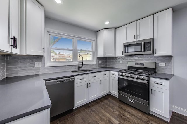 2219 Keystone Ave, North Riverside, IL 60546 - kitchen with stainless steel appliances, white cabinetry, dark wood finished floors, dark countertops, and decorative backsplash