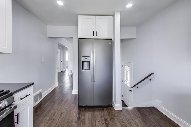 2219 Keystone Ave, North Riverside, IL 60546 - kitchen featuring appliances with stainless steel finishes, white cabinetry, dark wood-style flooring, recessed lighting, and dark countertops