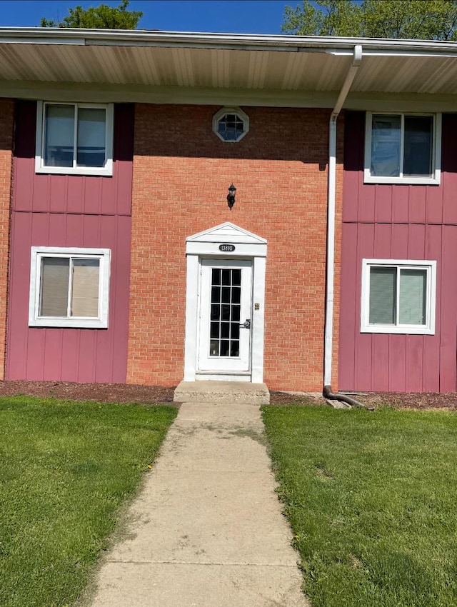 1389 Monomoy St Unit B2, Aurora, IL 60506 - entrance to property with a lawn and brick siding