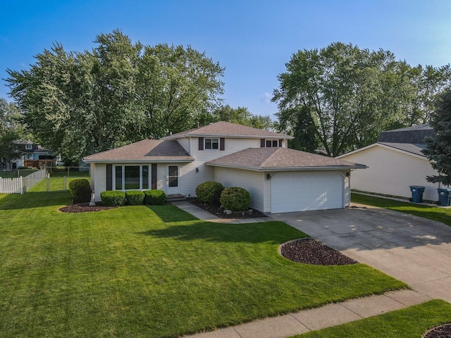 350 Kathy Dr, Bourbonnais, IL 60914 - tri-level home with an attached garage, concrete driveway, and a shingled roof