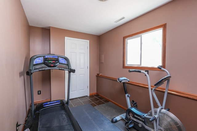 350 Kathy Dr, Bourbonnais, IL 60914 - workout room featuring dark tile patterned floors and baseboards