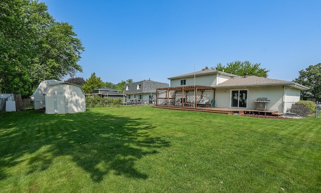 350 Kathy Dr, Bourbonnais, IL 60914 - back of house featuring a storage shed, a wooden deck, a pergola, and a fenced backyard