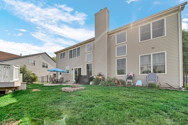 2316 Loop Rd, Algonquin, IL 60102 - rear view of house with a chimney, a lawn, and a patio area