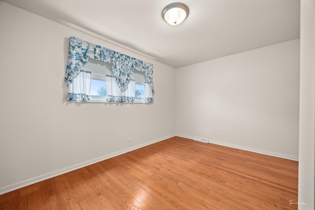 7325 173rd St, Tinley Park, IL 60477 - unfurnished room with baseboards and light wood-style floors