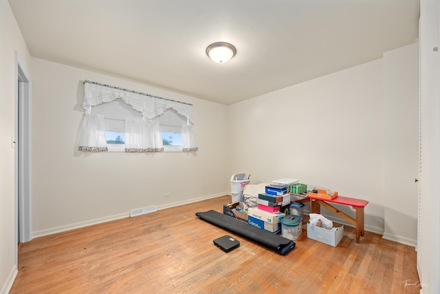 7325 173rd St, Tinley Park, IL 60477 - workout area featuring hardwood / wood-style flooring and baseboards