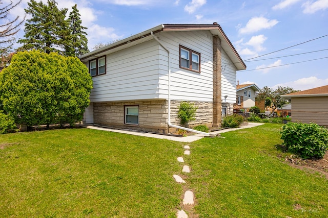 7325 173rd St, Tinley Park, IL 60477 - view of property exterior featuring a yard and stone siding