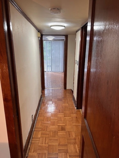 hall featuring baseboards