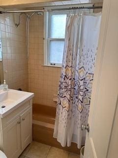 full bath with tile patterned flooring, vanity, and toilet