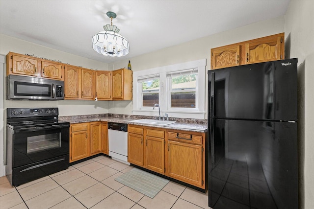 426 S Mcclellan St, Decatur, IL 62522 - kitchen featuring black appliances, a chandelier, light tile patterned floors, pendant lighting, and brown cabinets