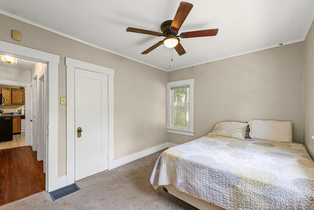 426 S Mcclellan St, Decatur, IL 62522 - bedroom with dark colored carpet, ornamental molding, and ceiling fan