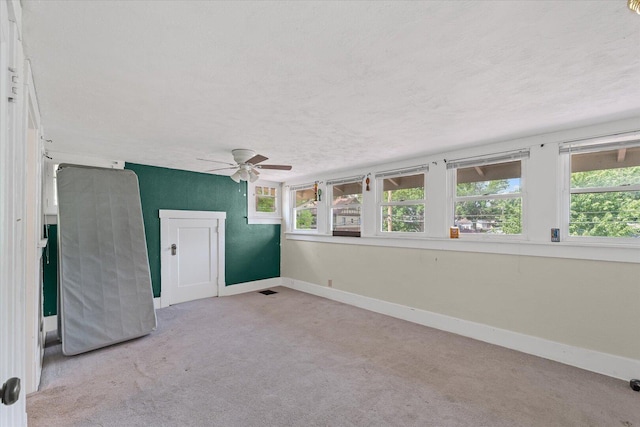 426 S Mcclellan St, Decatur, IL 62522 - empty room with a ceiling fan, light carpet, and a textured ceiling