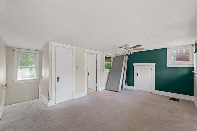 426 S Mcclellan St, Decatur, IL 62522 - unfurnished bedroom featuring carpet and ceiling fan
