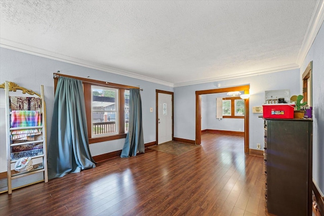 426 S Mcclellan St, Decatur, IL 62522 - spare room with a textured ceiling, crown molding, and hardwood / wood-style flooring