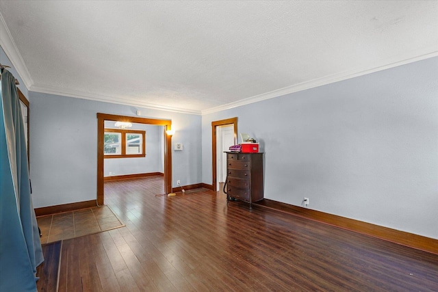 426 S Mcclellan St, Decatur, IL 62522 - empty room with dark wood-style floors, ornamental molding, and a textured ceiling