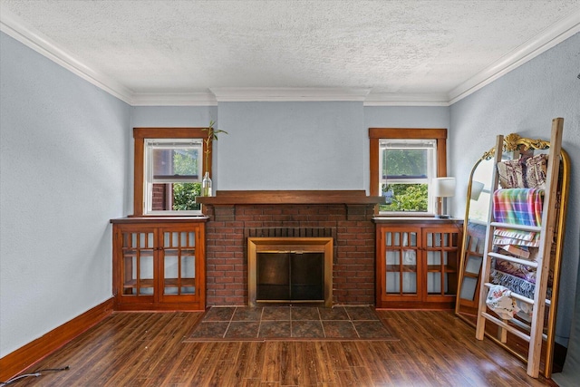 426 S Mcclellan St, Decatur, IL 62522 - living room featuring a fireplace, wood finished floors, ornamental molding, and a textured ceiling