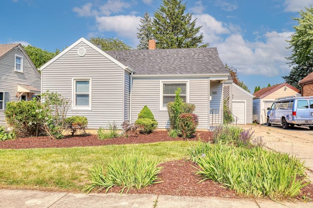 165 S Commonwealth Ave, Elgin, IL 60123 - view of front of property with a chimney, a garage, and a shingled roof