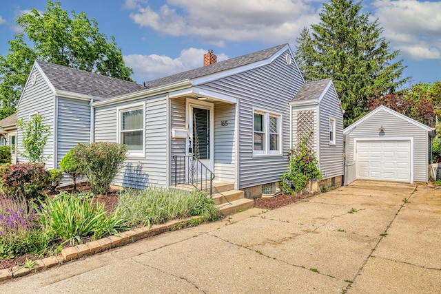 165 S Commonwealth Ave, Elgin, IL 60123 - bungalow featuring an outbuilding, a chimney, roof with shingles, driveway, and a garage