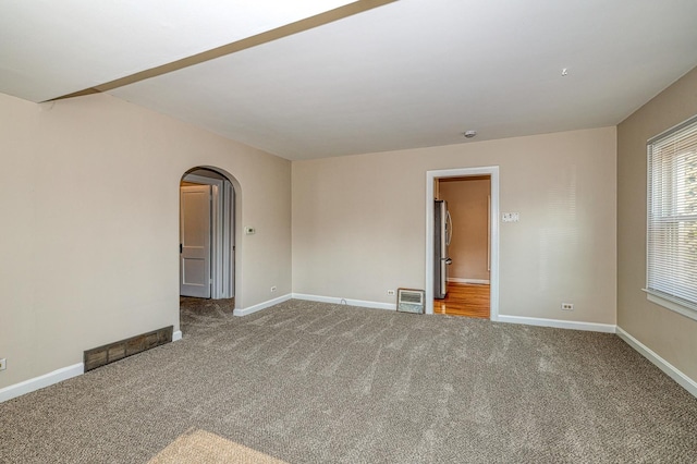 165 S Commonwealth Ave, Elgin, IL 60123 - unfurnished room featuring arched walkways and carpet flooring