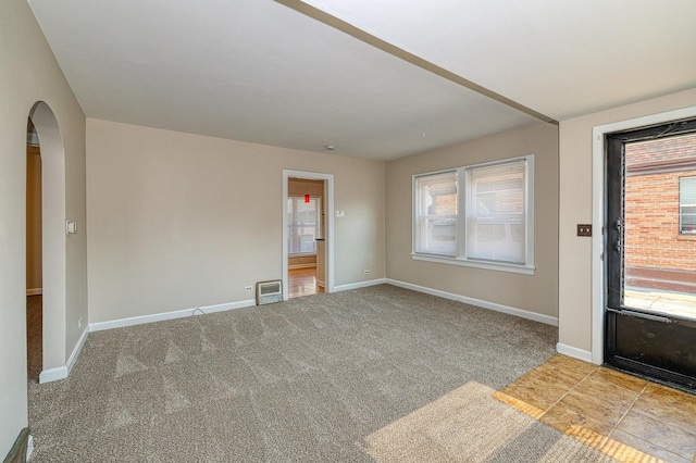 165 S Commonwealth Ave, Elgin, IL 60123 - foyer with arched walkways, healthy amount of natural light, and carpet floors