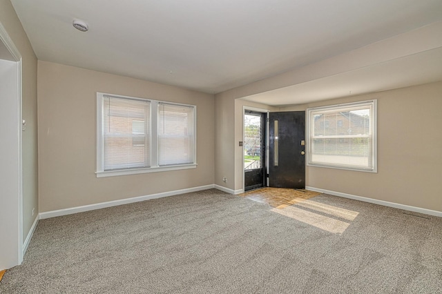 165 S Commonwealth Ave, Elgin, IL 60123 - carpeted foyer featuring baseboards
