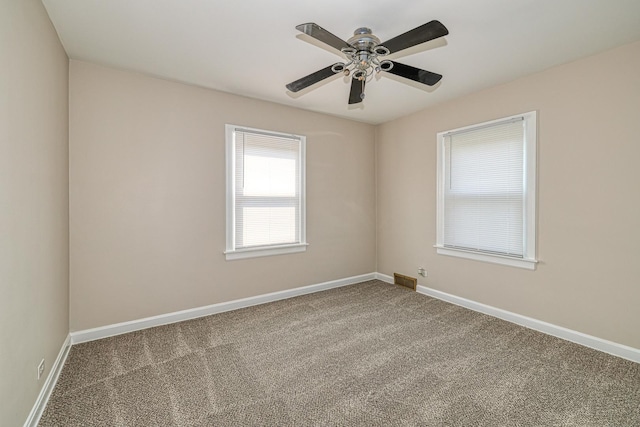 165 S Commonwealth Ave, Elgin, IL 60123 - carpeted empty room with baseboards and a ceiling fan