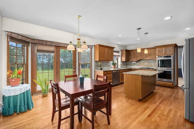 1364 Yorkshire Ln, Carol Stream, IL 60188 - dining area featuring light wood finished floors, healthy amount of natural light, a chandelier, and recessed lighting