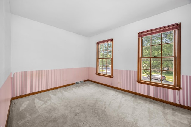 1364 Yorkshire Ln, Carol Stream, IL 60188 - carpeted empty room with a wainscoted wall and plenty of natural light