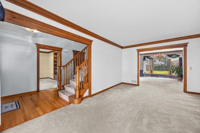 1364 Yorkshire Ln, Carol Stream, IL 60188 - unfurnished living room featuring a chandelier, crown molding, stairs, and carpet floors