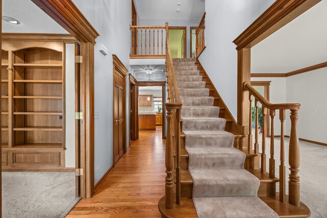 1364 Yorkshire Ln, Carol Stream, IL 60188 - stairs with wood finished floors, a high ceiling, and crown molding