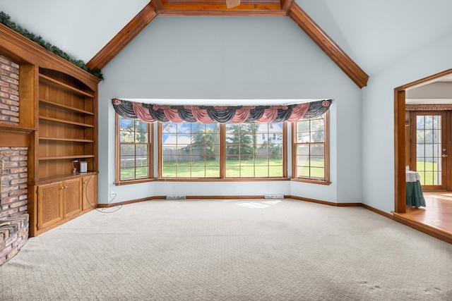 1364 Yorkshire Ln, Carol Stream, IL 60188 - unfurnished living room with carpet floors, beam ceiling, and high vaulted ceiling